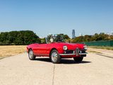 an image of a red convertible car parked on the side of the road