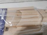 a wooden cutting board that has been wrapped in plastic