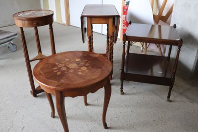 three tables and two chairs in a room