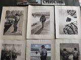 many pictures of soldiers on display on a table