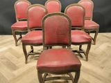 set of six red leather dining chairs with gold trim