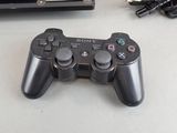 a video game controller sitting next to a game console