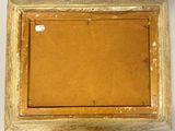 an old wooden picture frame with a brown canvas on it