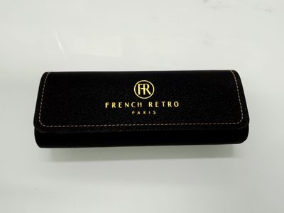 a black purse with a gold logo on it