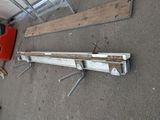 two pieces of wood that are laying on the ground