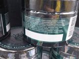 many jars of hemp oil on display in a store