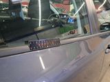 a sticker on the door handle of a car