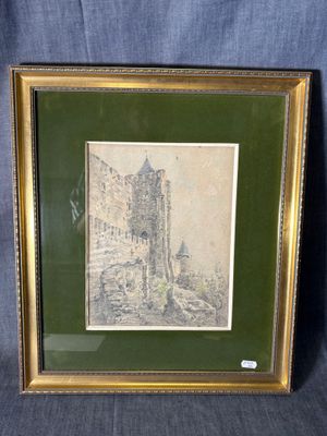 une photo d'un château dans un cadre doré
