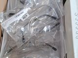 many pairs of scissors in a box on a table