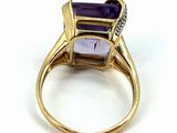 an image of a ring with an amethorate and diamonds on it