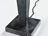 a lamp that is on a stand on a table