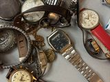 a lot of watches that are sitting on a table