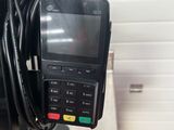 an image of a pos terminal connected to a laptop