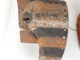 two pieces of wood that have been used to make a mask