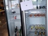 two refrigerators that have drinks in them in a store