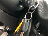 a car dashboard with a bunch of keys in it