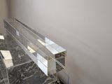 clear acrylic acrylic shelf on a marble counter top