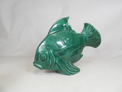 green ceramic fish figurine on a white background