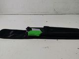 a black snowboard with a green handle on a white surface