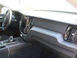 the interior of a car with a steering wheel and dashboard controls