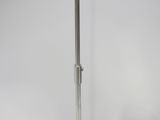 an image of an umbrella on a stand against a white wall