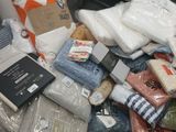 a pile of clothing that is sitting on the floor