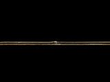 a close up of a gold bracelet on a black background