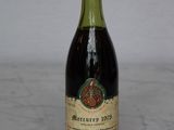 a bottle of wine that is sitting on a table
