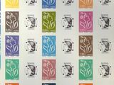 a sheet of stamps with different designs on them