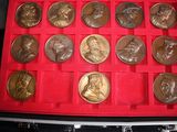 a red case with a lot of coins in it