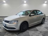 the volkswagen jetter is parked on a checkered tile floor
