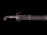 a close up of a knife on a black background