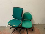 a green office chair and a green office chair in a room