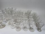 a lot of empty wine glasses sitting on a table