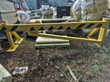 a yellow and black barricade that has been placed on the ground