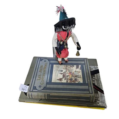 a figurine of a pirate on top of a book