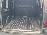 the back end of a van with the door open and the back door open