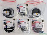 six pairs of headbands in plastic bags on a white surface