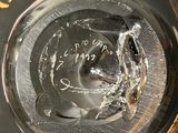 a close up of a glass of water with a hole in it
