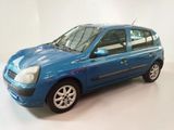 a blue car that is parked in a white room