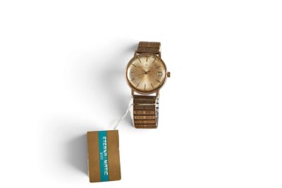 an image of a watch and a box of cigarettes on a white surface