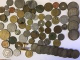 a lot of coins that are laying on a table