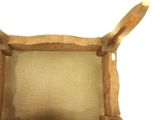 a brown paper bag with a wooden frame on it