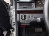 a car dashboard with a steering wheel and a dash panel