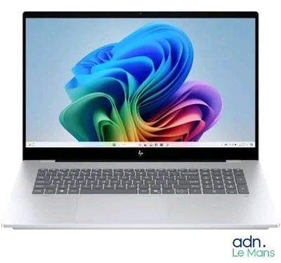 a white laptop with a colorful design on the screen