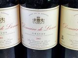 several bottles of wine are lined up on a table
