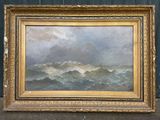 un tableau représentant des vagues, dans un cadre doré, posé par terre