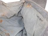 a close up view of a piece of clothing that has rust on it
