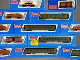several boxes of toy trains are stacked on top of each other