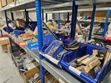 many bins and boxes on the shelves in the warehouse